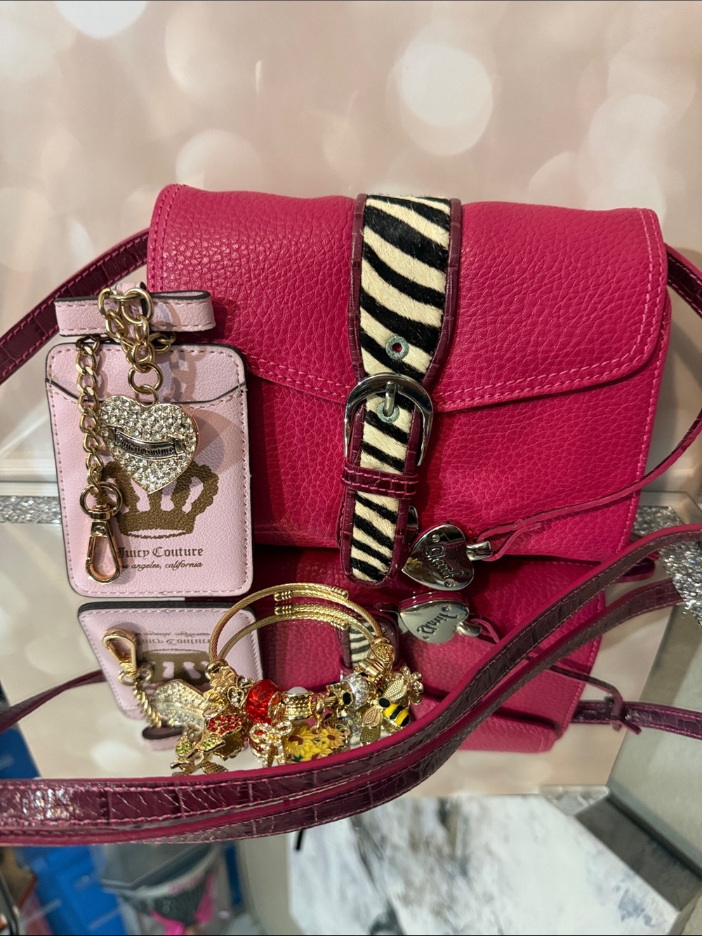 Sharif Fuchsia Pebbled Crossbody with Zebra Buckle Strap and Charm